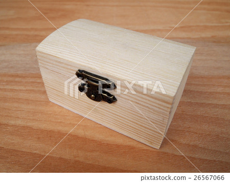 Small wooden box on wood grain background.  26567066