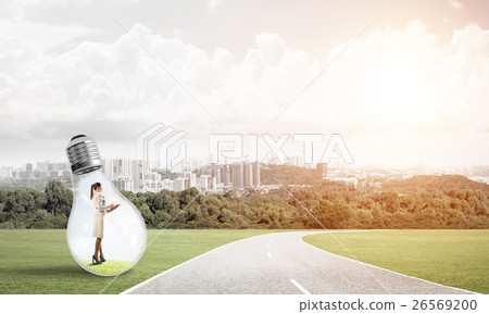 Businesswoman inside light bulb 26569200