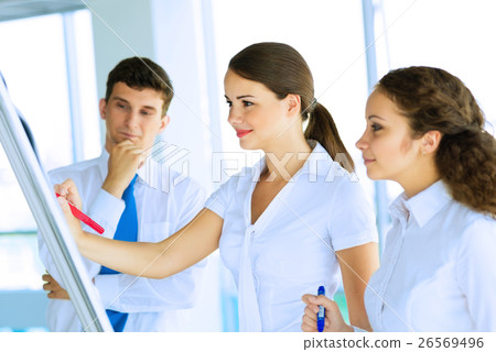 businessmen are meeting near the flipchart 26569496