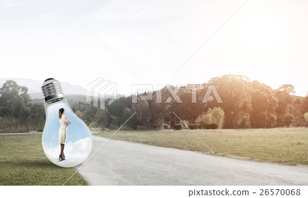 Businesswoman inside light bulb 26570068