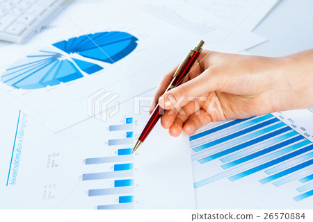 female hand pointing to the financial growth chart female hand pointing to the financial growth chart 26570884