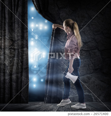 young woman looking at the scene 26571400