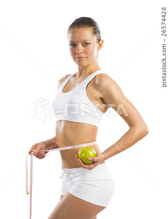young athletic woman measuring waist young athletic woman measuring waist 26574428