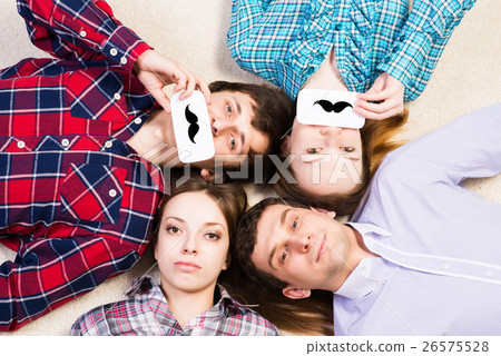 four young men lie together four young men lie together 26575528