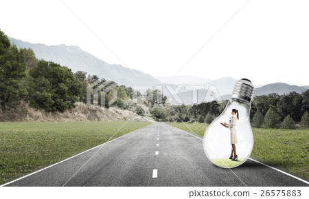 Businesswoman inside light bulb 26575883