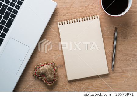 Blank notepad on wooden table 26576971