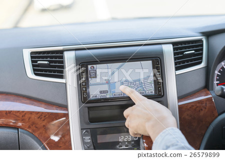 Hand of men who operate car navigation system Hand of men who operate car navigation system 26579899