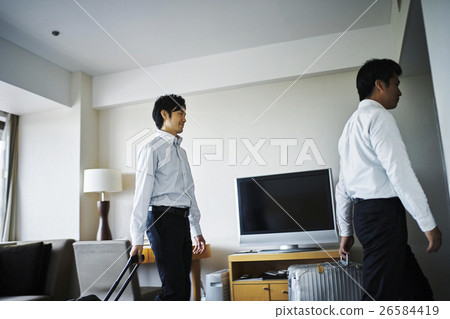 Hotel room departs businessman 26584419