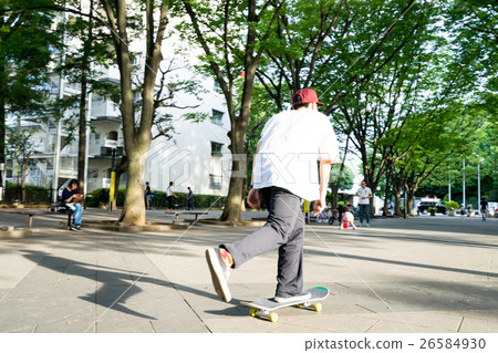 Men enjoying skateboarding 26584930