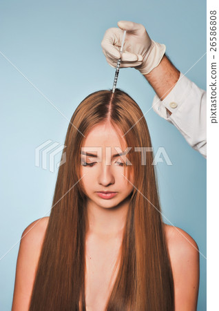 woman is getting injection in head. Mesotherapy. 26586808