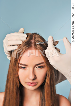 woman is getting injection in head. Mesotherapy. 26586830