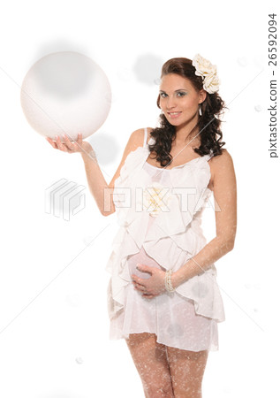 Beautiful pregnant woman with ball in snow Beautiful pregnant woman with ball in snow 26592094