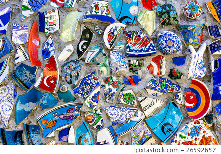 Wall with broken ceramic plates colored fragments 26592657