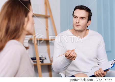 Professional male psychologist consulting young 26593267