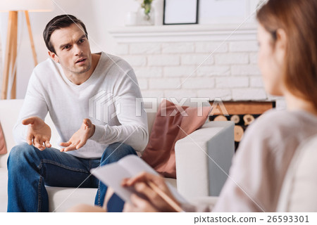 Emotional distressed man talking with psychologist 26593301
