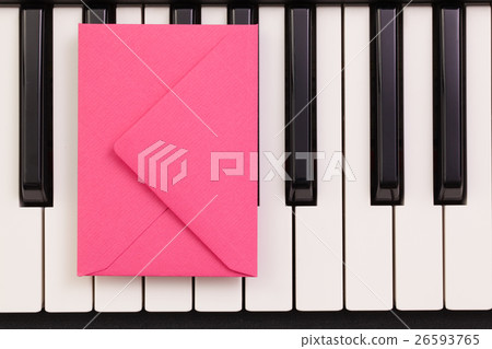 Funny arrangement envelope on the piano keybords 26593765