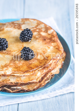 Crepes with blackberries on the wooden table 26595848