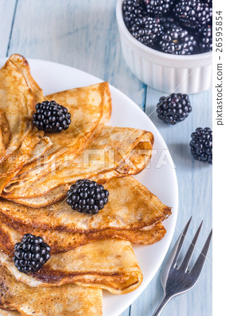Crepes with blackberries on the wooden table Crepes with blackberries on the wooden table 26595854