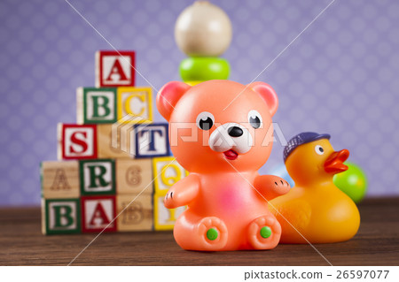 Children's of toy accessories on wooden background 26597077