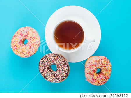 Cup of tea for breakfast with donuts in motion 26598152
