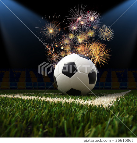 soccer ball on the green field 26610865