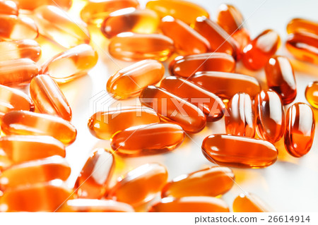 Gel capsules scattered on white background 26614914