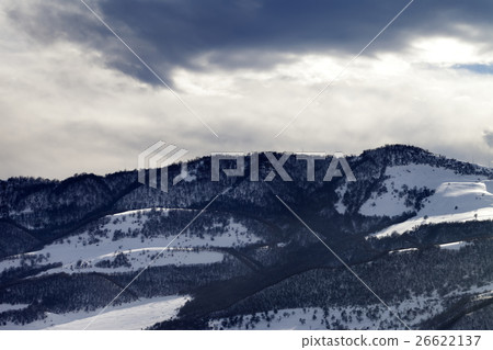 Winter snow mountains and storm clouds at evening 26622137