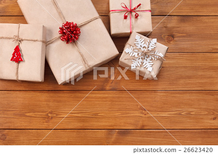 Christmas gift boxes on wood frame background Christmas gift boxes on wood frame background 26623420