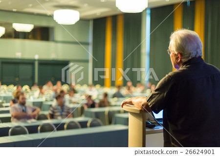 Senior public speaker giving talk at scientific Senior public speaker giving talk at scientific 26624901