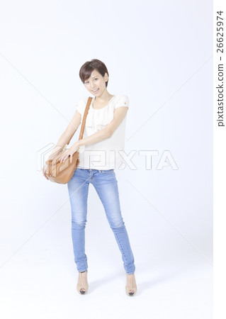 A woman with a shoulder bag A woman with a shoulder bag 26625974