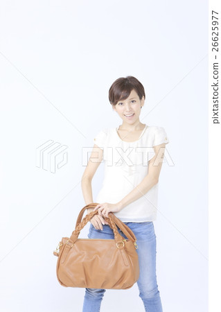 A woman with a shoulder bag A woman with a shoulder bag 26625977