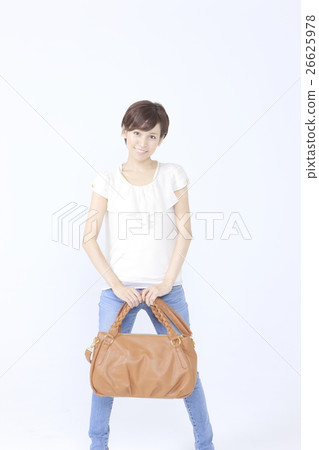 A woman with a shoulder bag A woman with a shoulder bag 26625978