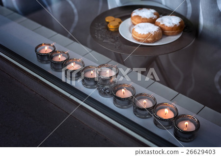 Nine-branched mehorah Hanukiah in the window 26629403