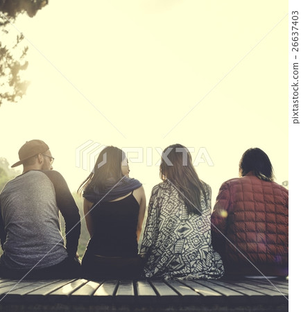 Friends Sitting in a Row Outdoors Concept Friends Sitting in a Row Outdoors Concept 26637403