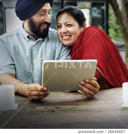 Indian Couple Using Device Concept 26638887