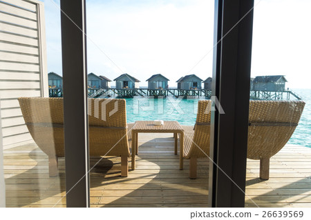 Beautiful tropical Maldives resort hotel with beach and blue water. Beautiful tropical Maldives resort hotel with beach and blue water. 26639569