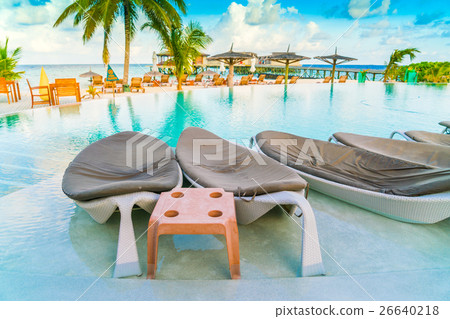 Table and chairs at restaurant in tropical Maldives island . Table and chairs at restaurant in tropical Maldives island . 26640218