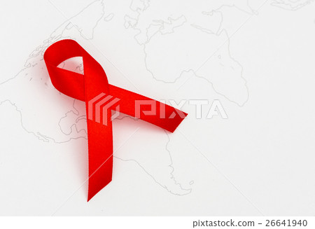Aids Awareness Red heart Ribbon on world map . 26641940