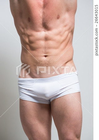 Athletic Man showing muscular body and sixpack abs 26643015