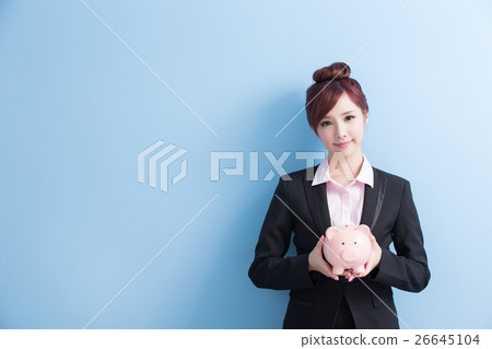 woman take pink piggy bank woman take pink piggy bank 26645104