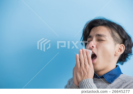 man is sick and sneezing 26645277
