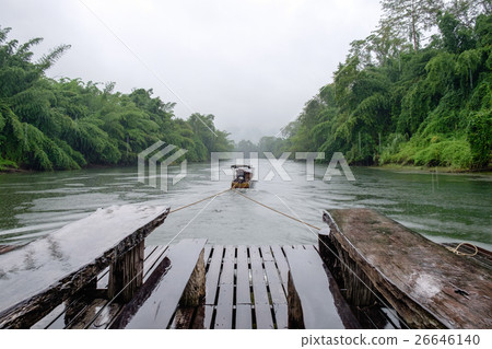 Longtail boat drag wooden raft in river kwai 26646140