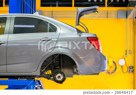Car rear side lifting scissors in garage Car rear side lifting scissors in garage 26648417