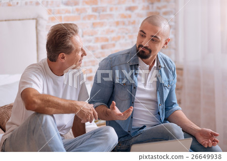Involved friends discussing the topic at home 26649938
