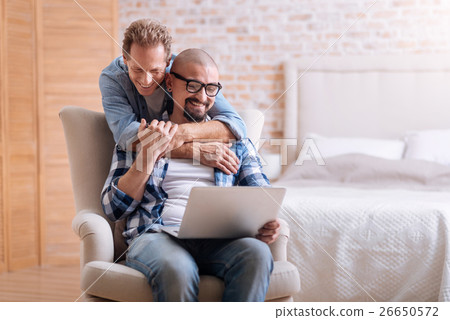 Happy gay couple expressing their love to each Happy gay couple expressing their love to each 26650572