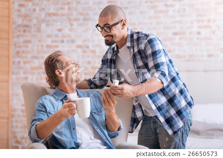 Cheerful young man making the proposal to his aged Cheerful young man making the proposal to his aged 26650573