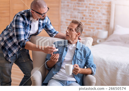 Delighted young man making the proposal to his Delighted young man making the proposal to his 26650574