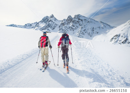 Group of climbers roped to the summit 26655158