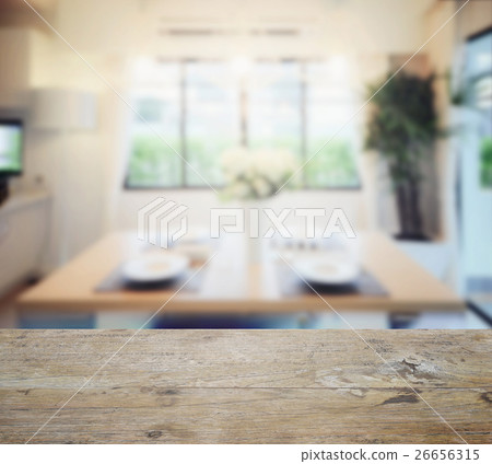 wooden table top with blur of dining room interior 26656315
