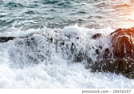 Foam from splash of sea wave attack to the rock Foam from splash of sea wave attack to the rock 26658287